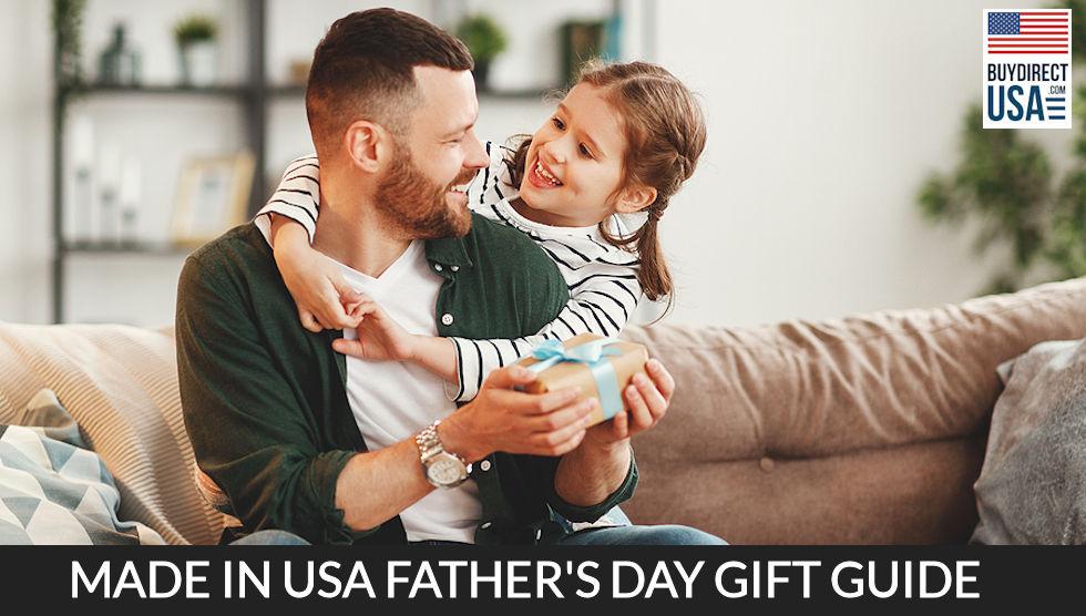 The best Father's Day gifts 2022 Father and child wearing traditional kinte  cloth- Super hero dad - Strong muscular black man cradling a baby